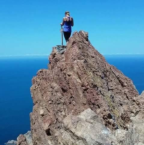 kristin-knerr-at-the-top-of-the-mountain